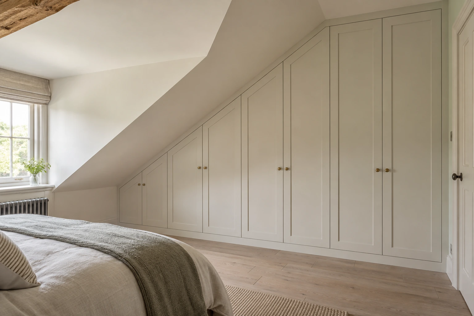 Illustration of fitted wardrobes following a sloping bedroom ceiling