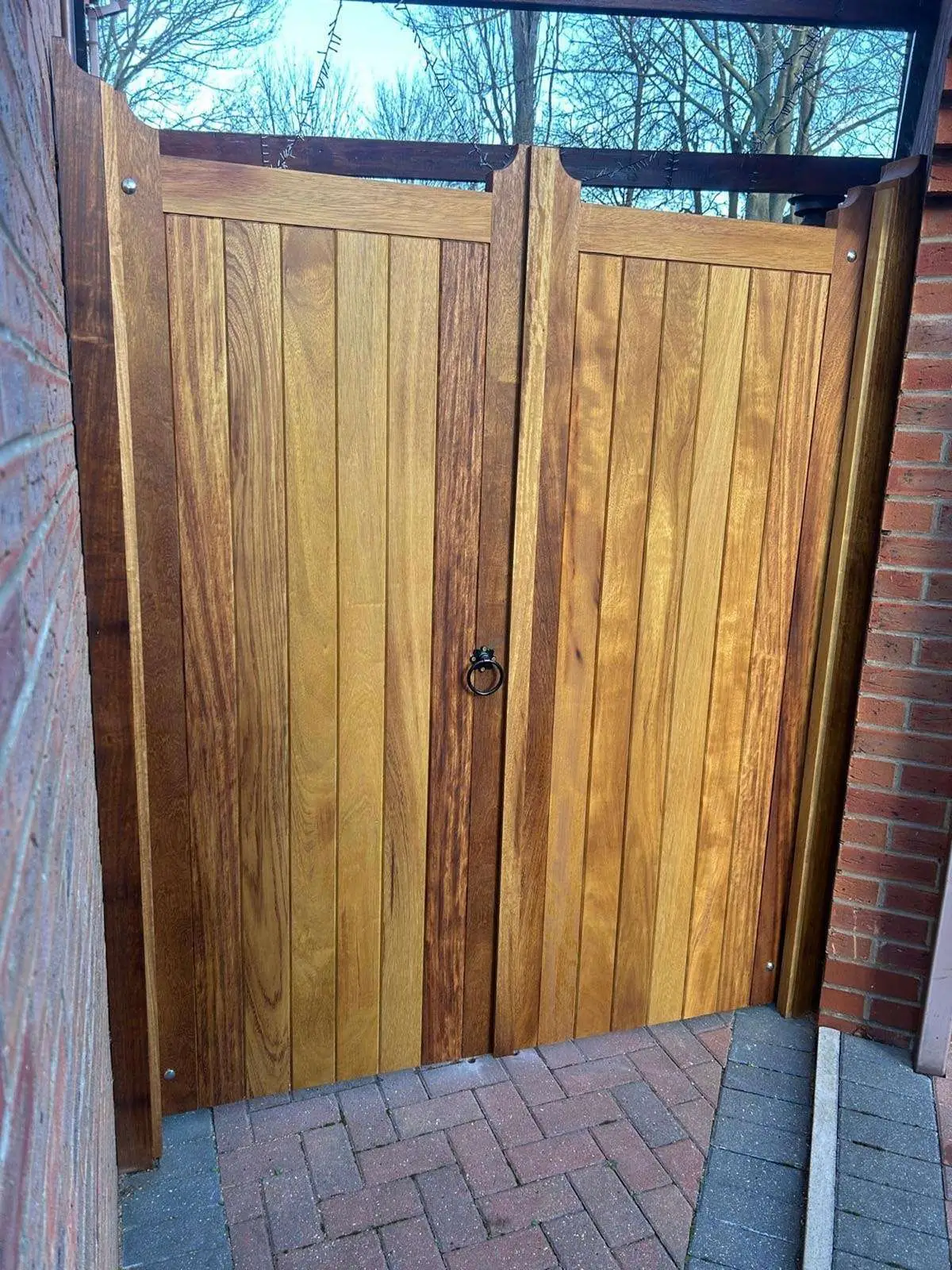 Pair of timber garden gates with a glazed panel above